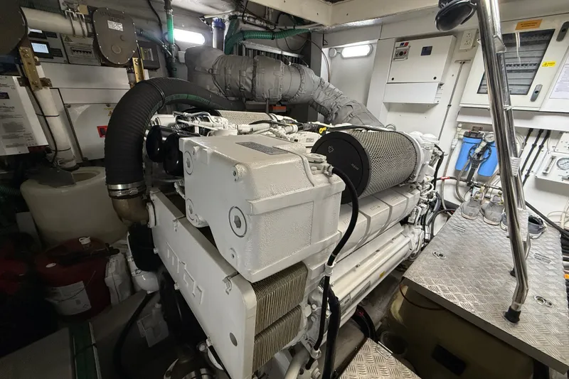 Slide: The Image of Engine room of a 2014 Sunseeker Predator 68 yacht, showcasing machinery and equipment. - 54