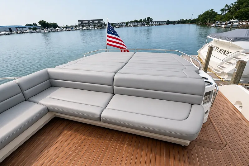 Slide: The Image of Luxurious Sunseeker Predator 68 yacht deck with seating, 2014 model, docked by serene waters. - 15