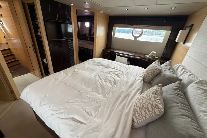 Slide: The Image of Luxurious bedroom interior of 2014 Sunseeker Predator 68 yacht with elegant furnishings. - 42
