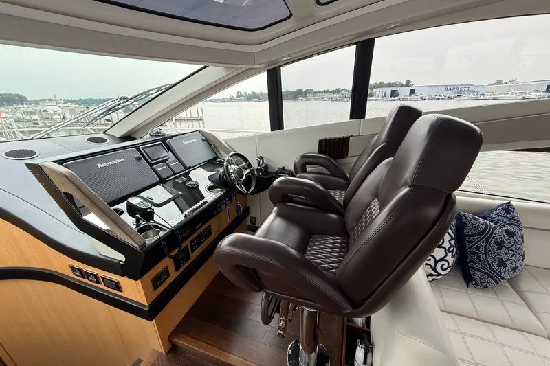 Slide: The Image of Luxurious 2014 Sunseeker Predator 68 yacht cockpit with leather seats and advanced navigation systems. - 24