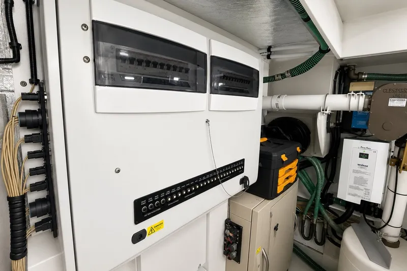 Slide: The Image of Electrical control panel in a 2014 Sunseeker Predator 68 yacht engine room. - 61
