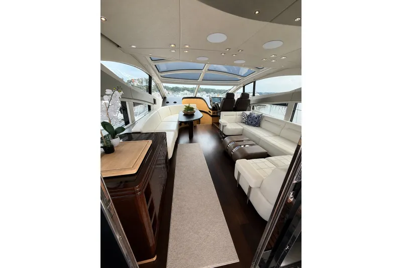 Slide: The Image of Luxurious interior of 2014 Sunseeker Predator 68 yacht with elegant seating and panoramic windows. - 26