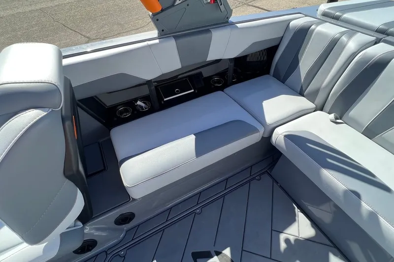 Slide: The Image of 2023 Malibu Wakesetter 22 LSV interior with gray seating and cup holders. - 15
