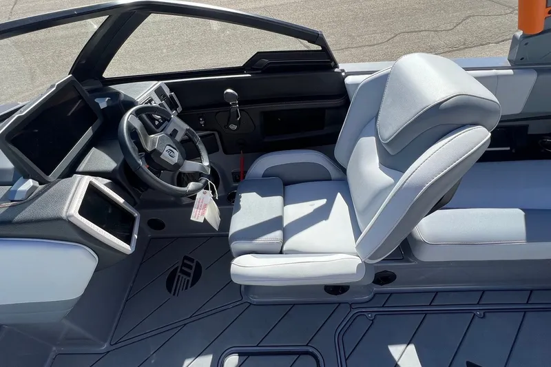 Slide: The Image of 2023 Malibu Wakesetter 22 LSV interior with modern helm and comfortable seating. - 16