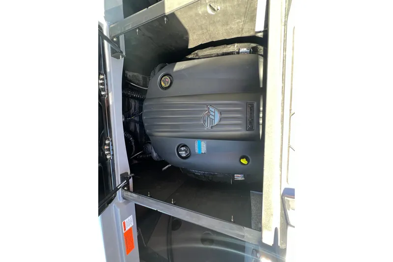 Slide: The Image of Engine compartment of 2023 Malibu Wakesetter 22 LSV boat, showcasing engine details. - 27