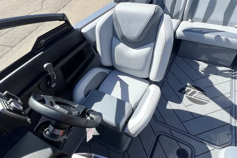 Slide: The Image of 2023 Malibu Wakesetter 22 LSV interior with sleek gray seating and modern dashboard design. - 20