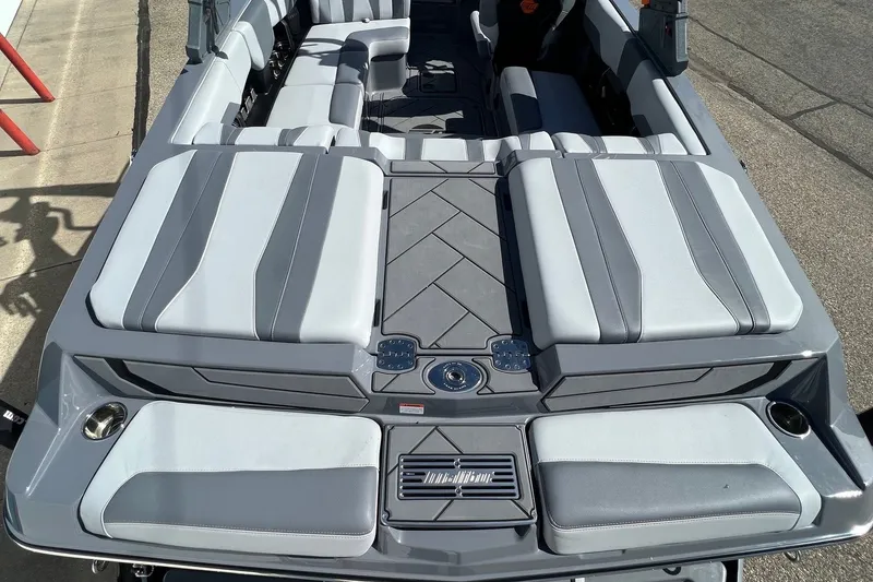 Slide: The Image of 2023 Malibu Wakesetter 22 LSV boat interior with gray seating and modern design. - 12