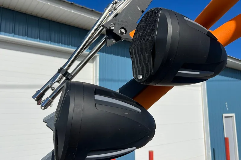 Slide: The Image of 2023 Malibu Wakesetter 22 LSV boat speakers mounted on orange tower. - 37
