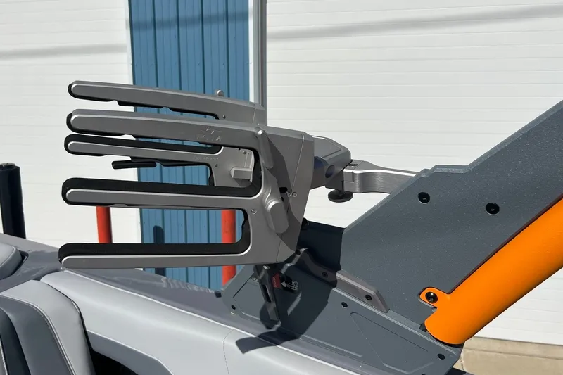 Slide: The Image of 2023 Malibu Wakesetter 22 LSV wakeboard rack in sleek gray and orange design. - 36