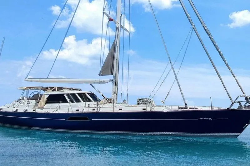 The Image of 1987 Camper & Nicholsons cruising sailboat on clear blue water under a sunny sky. - 0