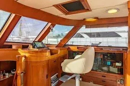 Slide: The Image of Luxurious interior of a 1987 Camper & Nicholsons cruising sailboat with wooden finishes. - 16