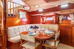 Slide: The Image of Luxurious 1987 Camper & Nicholsons cruising sailboat interior with elegant dining area. - 23