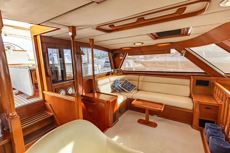 Slide: The Image of Luxurious 1987 Camper & Nicholsons cruising sailboat interior with elegant wood finish and plush seating. - 17