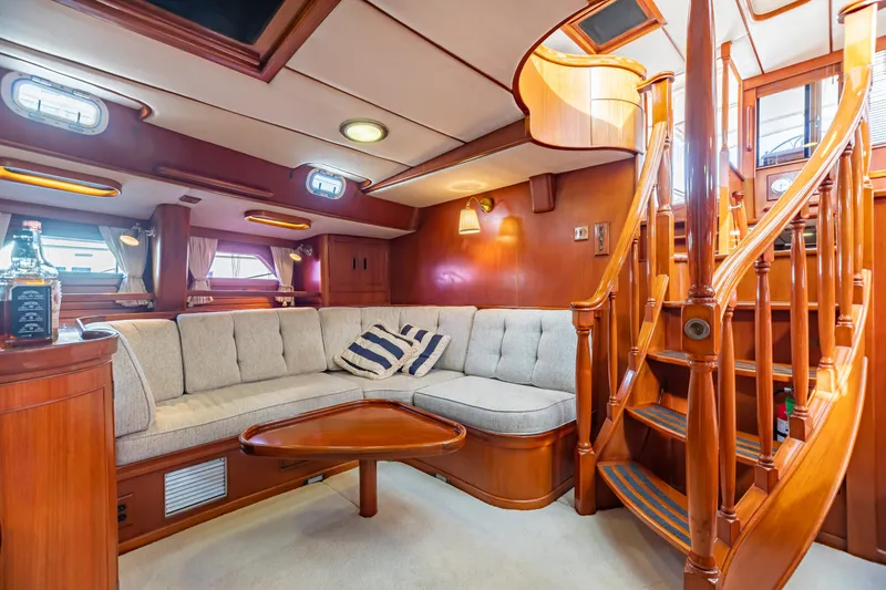 Slide: The Image of Luxurious 1987 Camper & Nicholsons cruising sailboat interior with elegant woodwork and cozy seating. - 20
