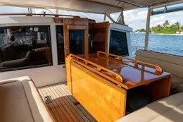 Slide: The Image of 1987 Camper & Nicholsons cruising sailboat interior with wooden table and seating. - 13