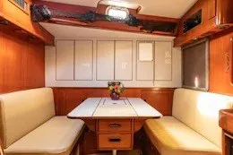Slide: The Image of Interior of 1987 Camper & Nicholsons cruising sailboat with cozy dining area. - 26