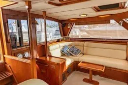 Slide: The Image of Luxurious 1987 Camper & Nicholsons cruising sailboat interior with elegant wood finish and plush seating. - 18