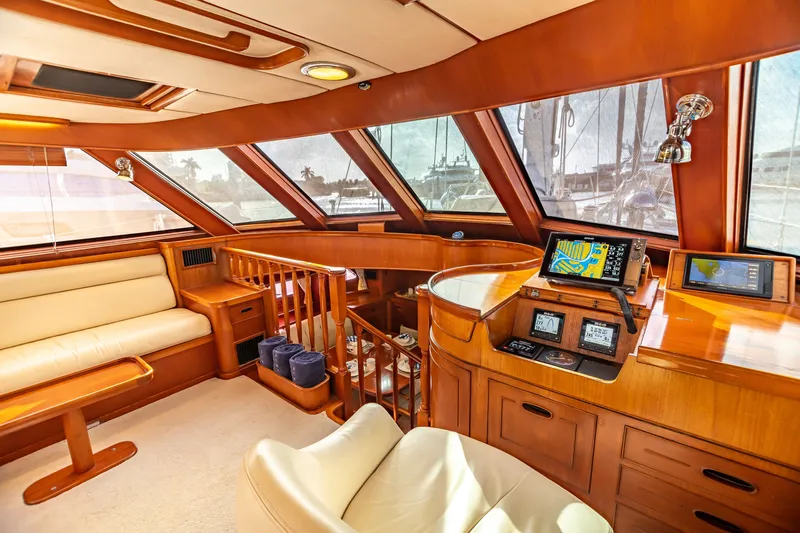 Slide: The Image of Luxurious 1987 Camper & Nicholsons cruising sailboat interior with navigation equipment and plush seating. - 14