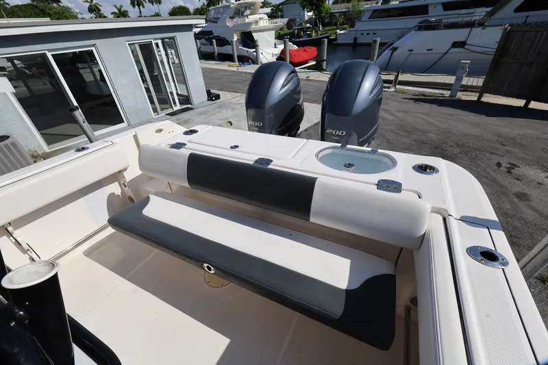 Slide: The Image of 2023 Robalo R242 Explorer boat with dual engines and seating area. - 20