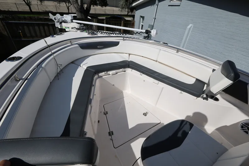 Slide: The Image of 2023 Robalo R242 Explorer boat interior with spacious seating and modern design. - 14