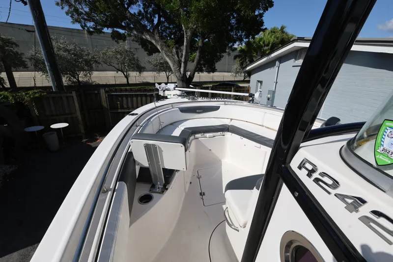 Slide: The Image of 2023 Robalo R242 Explorer boat interior with seating and console details. - 13
