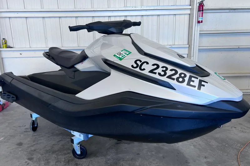 The Image of 2024 Taiga Orca jet ski in a garage, featuring registration number SC 2328 EF. - 0