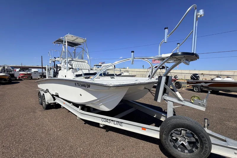 The Image of 2016 Dargel 250 HDX boat on trailer under clear blue sky. - 0