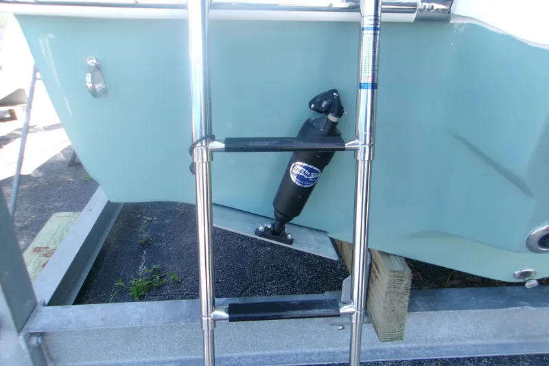Slide: The Image of Stainless steel ladder on 2027 Key West 219 FS boat, docked on trailer. - 5