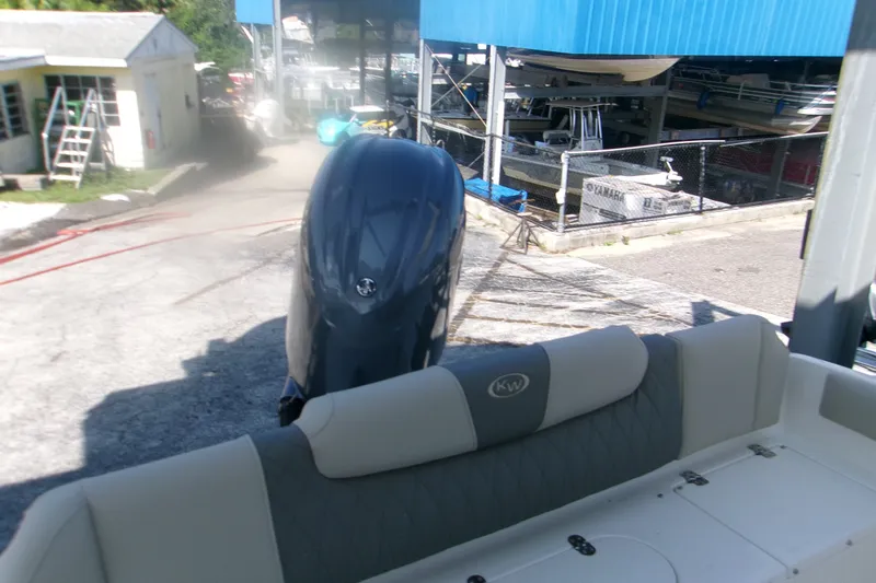 Slide: The Image of 2027 Key West 219 FS boat with Yamaha outboard motor in a marina setting. - 10