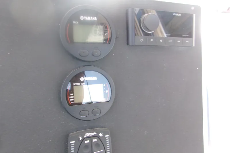 Slide: The Image of Dashboard of 2027 Key West 219 FS boat with Yamaha gauges and Fusion audio system. - 7