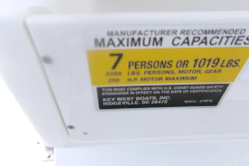 Slide: The Image of Key West 219 FS 2027 boat capacity label: 7 persons or 1019 lbs maximum. - 18