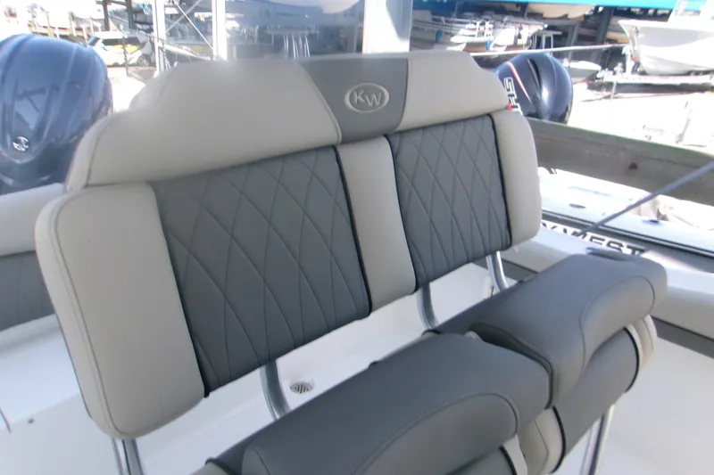 Slide: The Image of 2027 Key West 219 FS boat with cushioned seating and sleek design. - 11
