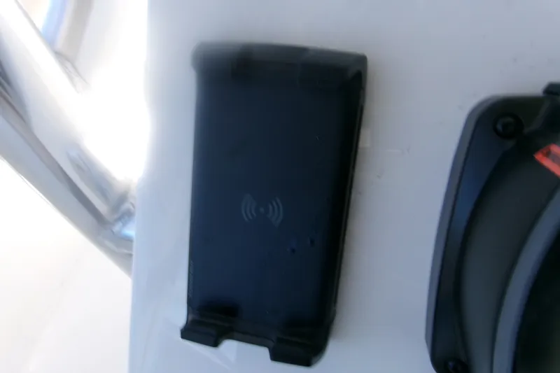Slide: The Image of Wireless charging pad on 2027 Key West 219 FS boat dashboard. - 9