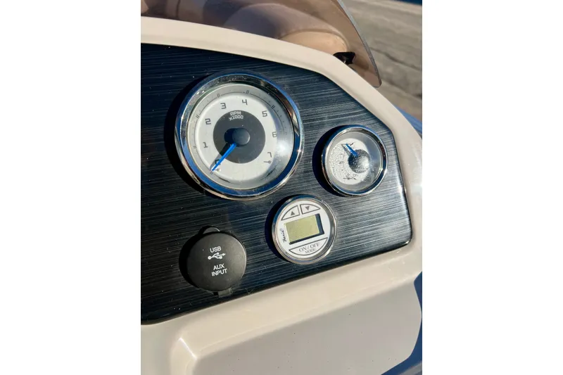 Slide: The Image of Dashboard of 2021 Starcraft EX 20 C boat with gauges and USB input. - 56