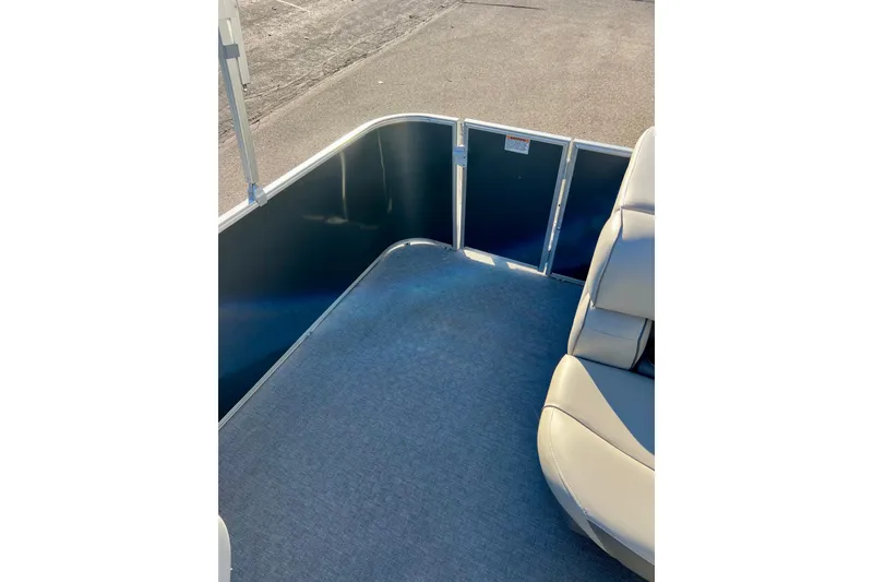 Slide: The Image of Interior view of 2021 Starcraft EX 20 C pontoon boat with seating and flooring. - 71