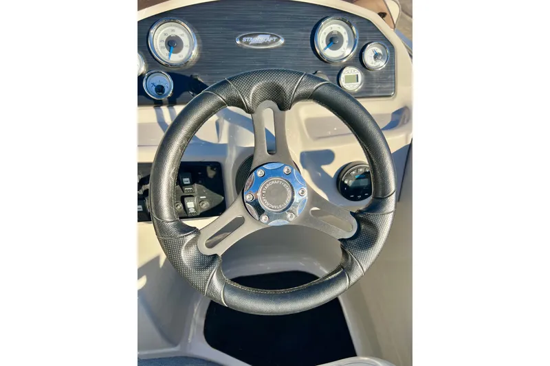 Slide: The Image of Steering wheel of 2021 Starcraft EX 20 C boat with dashboard gauges. - 53
