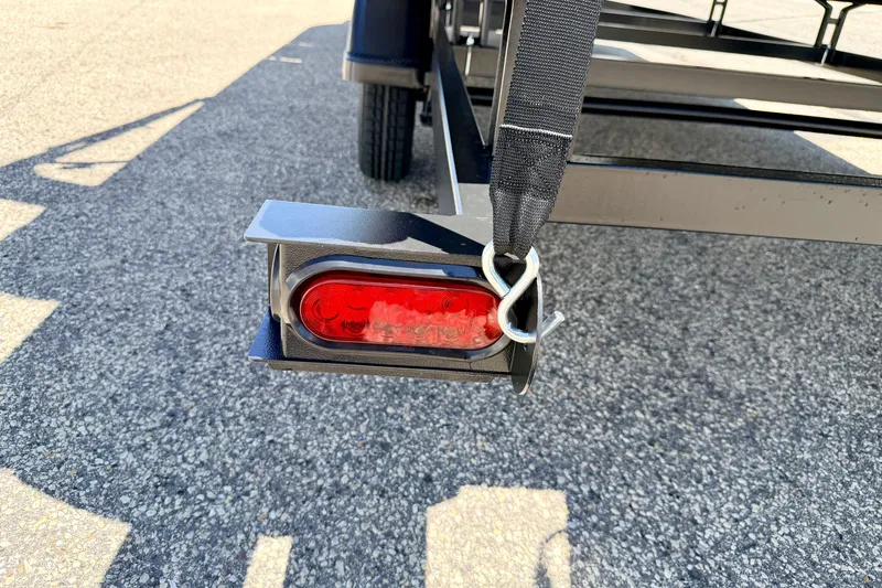 Slide: The Image of Trailer light and hitch on a 2021 Starcraft EX 20 C boat trailer. - 23