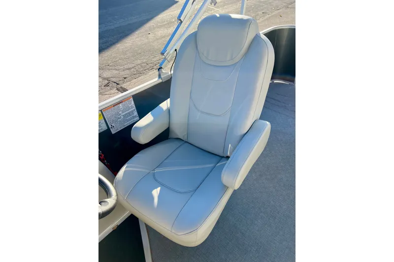 Slide: The Image of Comfortable captain's chair on 2021 Starcraft EX 20 C boat, featuring plush upholstery. - 60