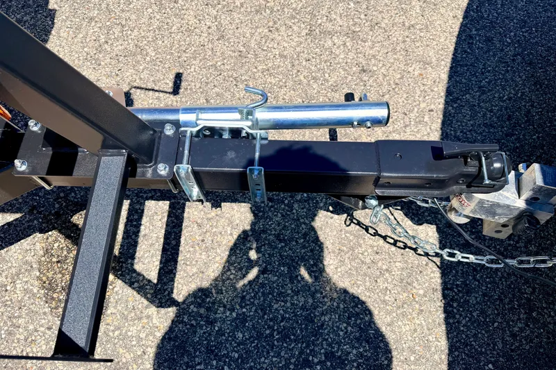 Slide: The Image of Trailer hitch of a 2021 Starcraft EX 20 C on asphalt surface. - 20