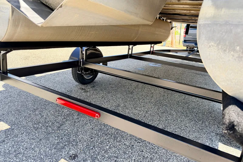 Slide: The Image of Underneath view of a 2021 Starcraft EX 20 C pontoon boat on a trailer. - 22