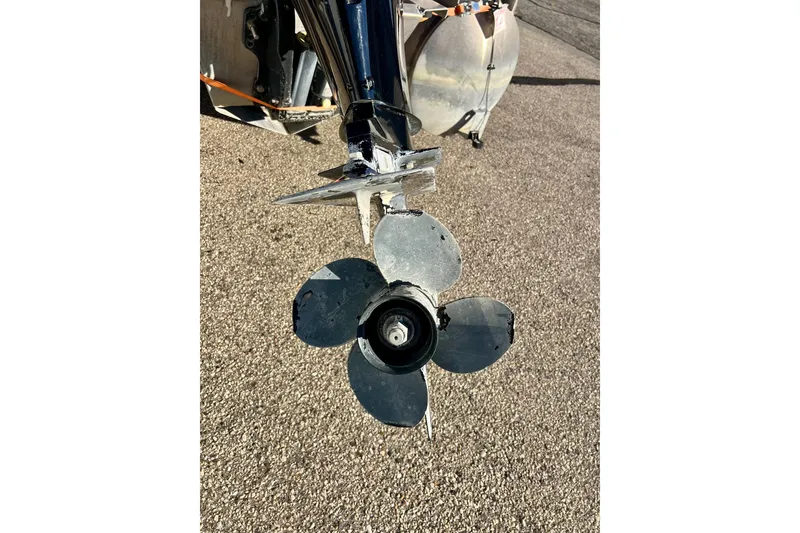 Slide: The Image of Propeller of 2021 Starcraft EX 20 C boat on pavement background. - 30