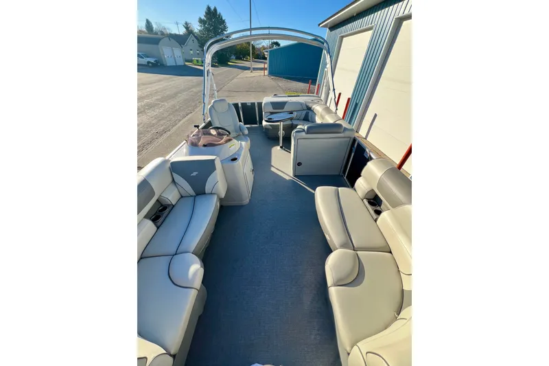 Slide: The Image of 2021 Starcraft EX 20 C pontoon boat interior with spacious seating and modern design. - 45