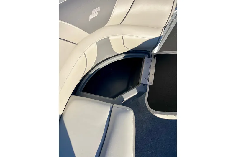 Slide: The Image of 2021 Starcraft EX 20 C boat interior storage compartment with cushioned seating. - 37