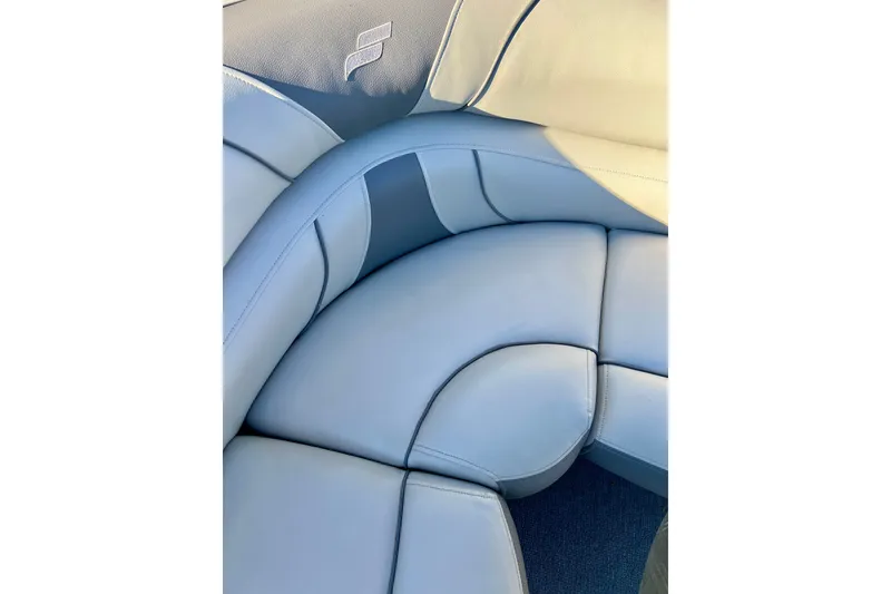 Slide: The Image of Luxurious seating in a 2021 Starcraft EX 20 C boat, featuring elegant upholstery design. - 64