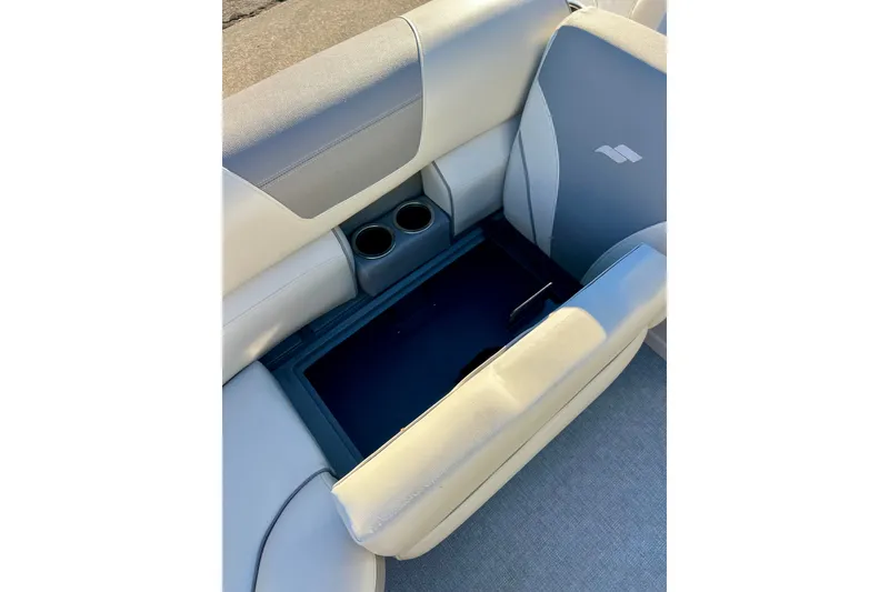 Slide: The Image of 2021 Starcraft EX 20 C boat seat with storage compartment and cup holders. - 42