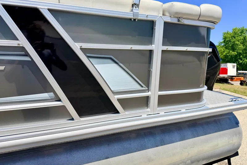 Slide: The Image of 2021 Starcraft EX 20 C pontoon boat with sleek metallic design and comfortable seating. - 11