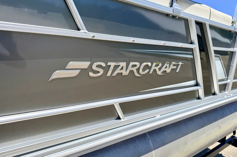 Slide: The Image of 2021 Starcraft EX 20 C pontoon boat with sleek metallic design. - 10