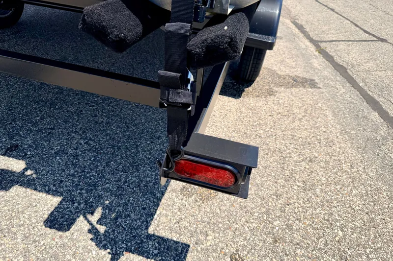 Slide: The Image of Trailer hitch and light on 2021 Starcraft EX 20 C boat trailer. - 21