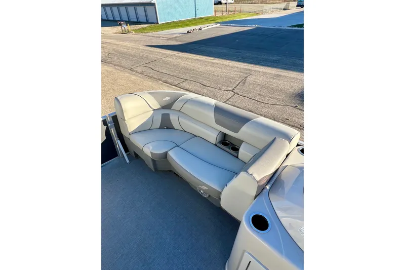 Slide: The Image of Luxurious seating on 2021 Starcraft EX 20 C pontoon boat, featuring cup holders. - 79