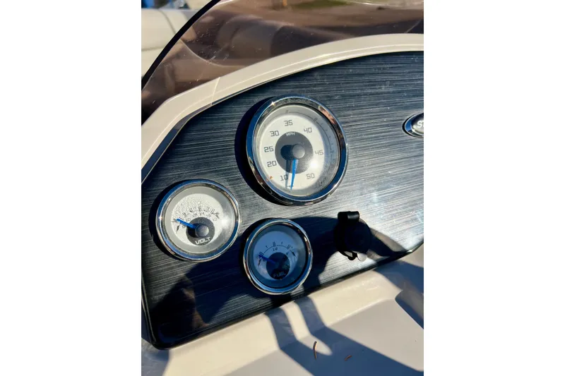 Slide: The Image of Dashboard of 2021 Starcraft EX 20 C boat with speedometer and voltmeter gauges. - 55